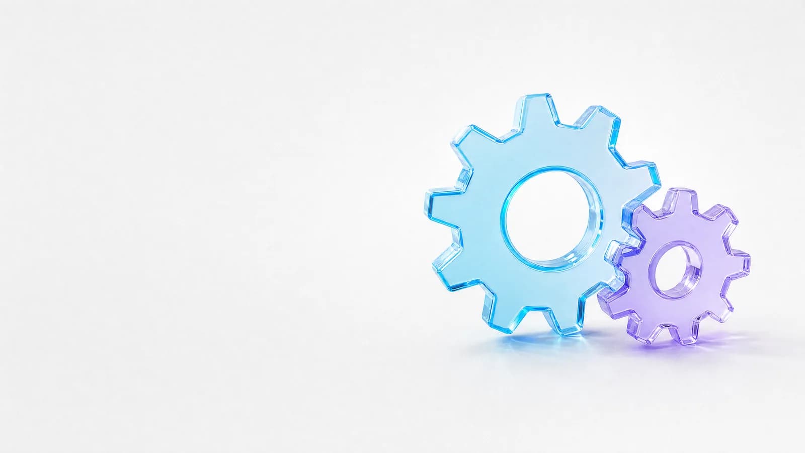 Abstract glass object in ALPENIQ blue: two interlocking glass cogwheels