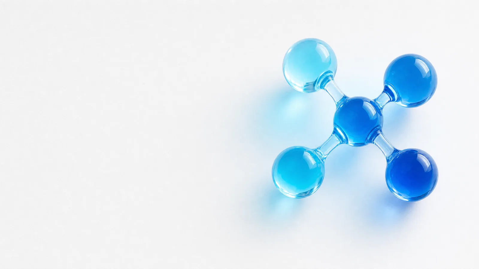 Abstract glass object in ALPENIQ blue: connected glass spheres forming network nodes