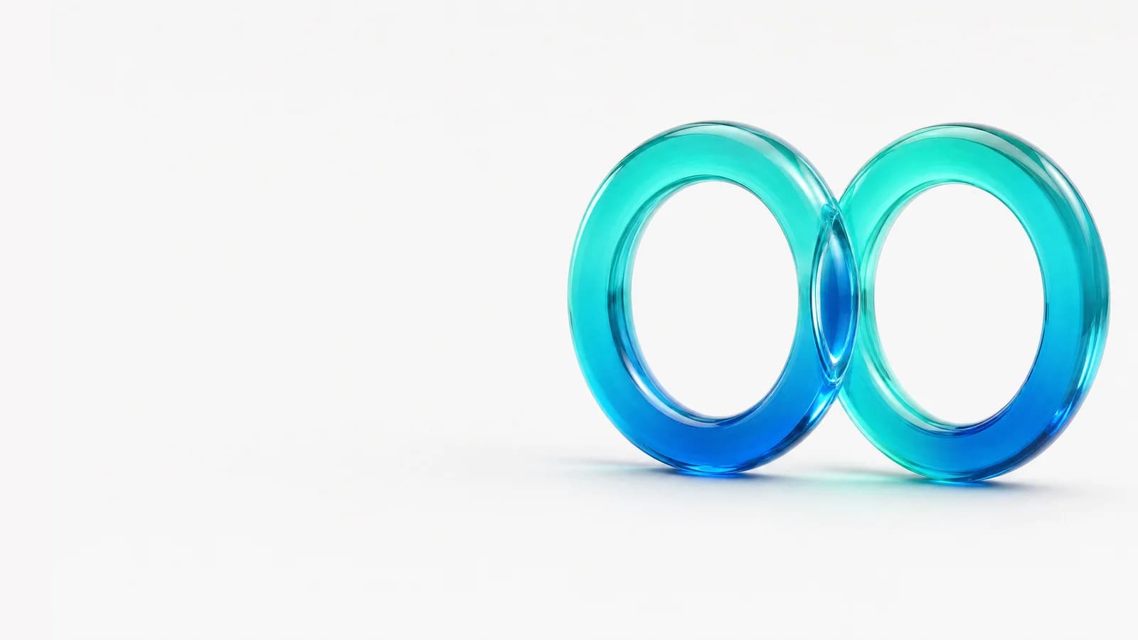 Abstract glass object in ALPENIQ blue: two glass rings overlapping in a narrow lens