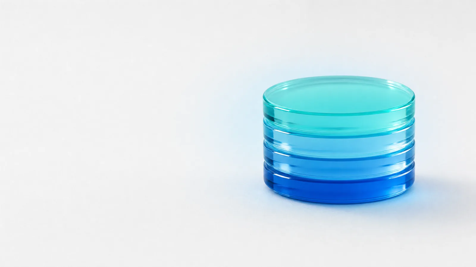 Abstract glass object in ALPENIQ blue: stack of round glass discs
